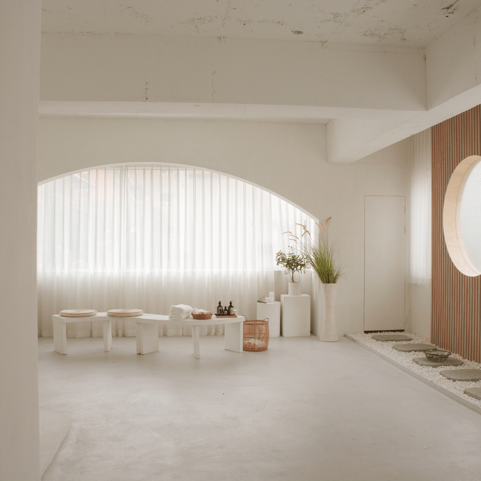 Modern minimalist salon interior with spa essentials and light wood accents